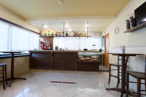 a kitchen with a counter and a counter top at La Piana Hotel in Tito