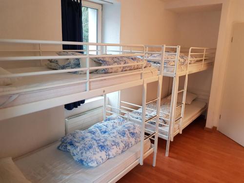 Postel nebo postele na pokoji v ubytování Bellpark Hostel