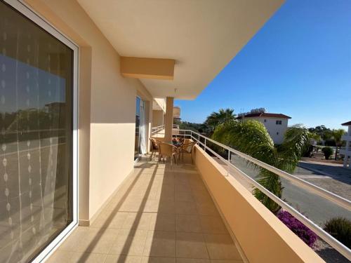 a balcony of a house with a view of the ocean at NISSI 3 VIEW HOLIDAY 2 BEDROOM APARTMENT in Ayia Napa