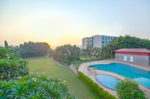an aerial view of a resort with a swimming pool at Lemon Tree Hotel Baddi in Baddi