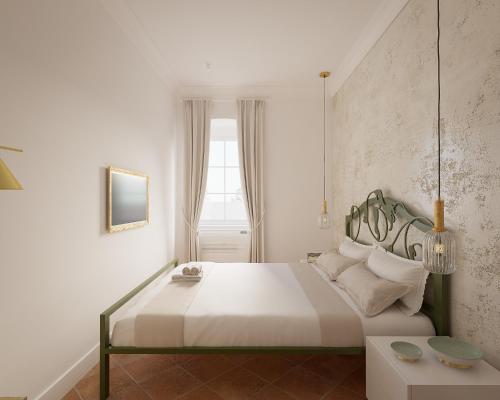a bedroom with a large white bed and a window at Vila Perast Boutique Hotel in Perast