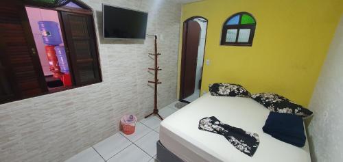 מיטה או מיטות בחדר ב-Pousada Fonseca