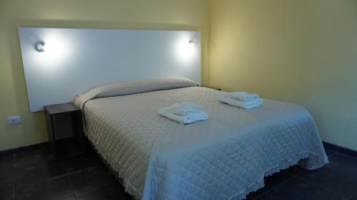 Ένα ή περισσότερα κρεβάτια σε δωμάτιο στο Laguna Park Duplex & Suites