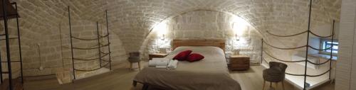 Postel nebo postele na pokoji v ubytování Le Vecchie Mura suite & room