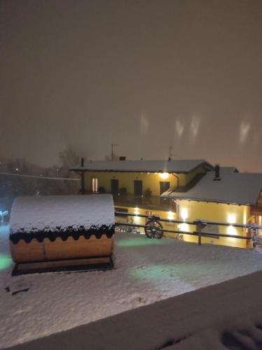 a snow covered box sitting on the roof of a house at Agriturismo La Soglia Del Parco in Ranica