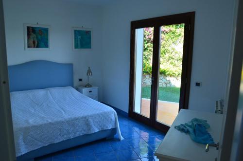 A bed or beds in a room at Villa Smeralda