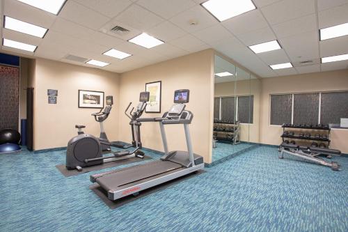 a gym with two treadmills and a treadmill at Holiday Inn Winchester Southeast-Historic Gateway by IHG in Winchester