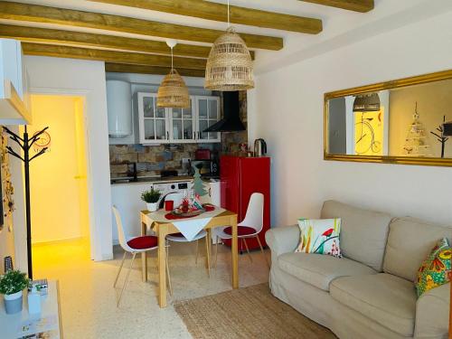 a living room with a couch and a table at Apartamento Rural El Bandolero in El Bosque