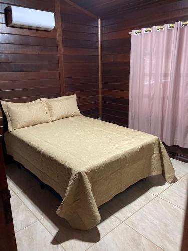 Uma cama ou camas num quarto em Casa Da Cris