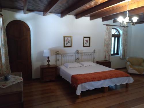 En eller flere senge i et værelse på Estância Timbaúva