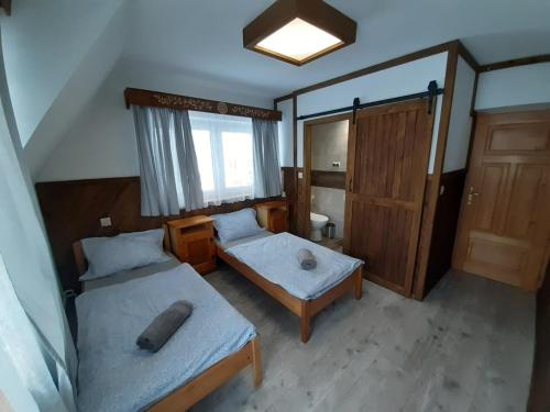 Postel nebo postele na pokoji v ubytování Na wierchu