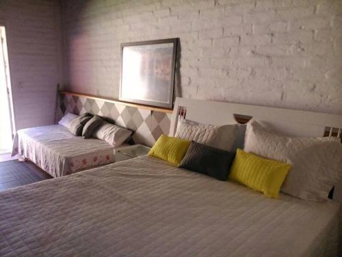 Ένα ή περισσότερα κρεβάτια σε δωμάτιο στο Casa LINDA TÉRREA e SUPER ACONCHEGANTE 3 Suítes