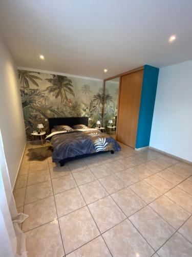 a bedroom with a bed and a painting on the wall at Villa del catalunya in Perpignan