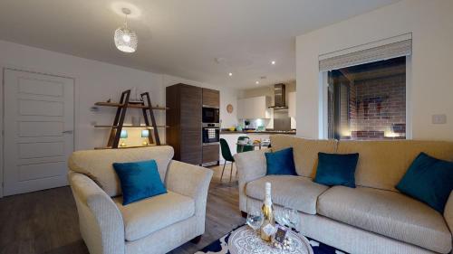 a living room with a couch and two chairs at Luxury 2 Bed Apartment with Parking near London in Swanscombe