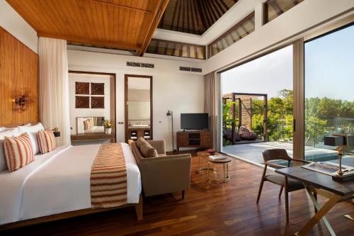 Un pat sau paturi într-o cameră la Eaze Villas Uluwatu