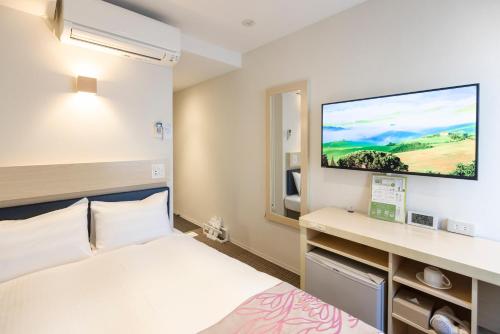 Кровать или кровати в номере Beppu Daiiti Hotel