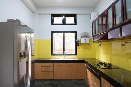 a kitchen with a sink and a window at JOY'S BNB in Imphal