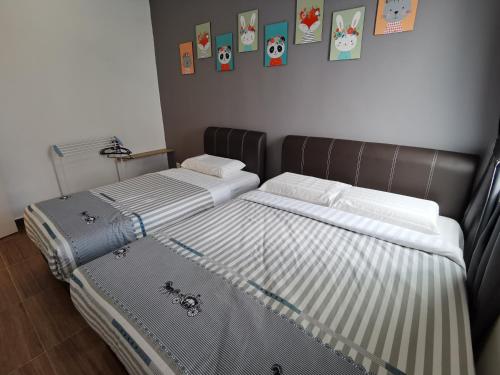 Llit o llits en una habitació de My Homestay N43 (14 pax) @ Golden Hills Night Market