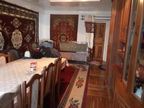 a dining room with a table and some chairs at Guest house Shairkul in Kyzylunkyur