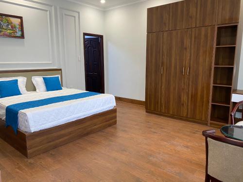 Кровать или кровати в номере Khách sạn Hoàng Minh Châu Mỹ Phước
