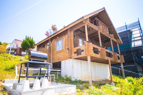 a house being built on top of a hill at Awaji Seaside Log house in Goshiki 1 in Sumoto