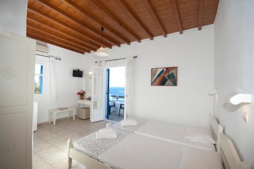 Ένα ή περισσότερα κρεβάτια σε δωμάτιο στο Megas Rooms