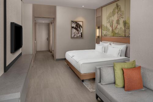 Una cama o camas en una habitación de NG Phaselis Bay