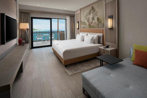 Una cama o camas en una habitación de NG Phaselis Bay