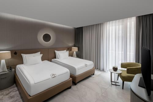 Una cama o camas en una habitación de NG Phaselis Bay