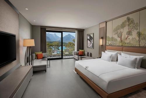 Una cama o camas en una habitación de NG Phaselis Bay