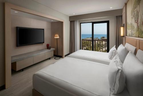 Una cama o camas en una habitación de NG Phaselis Bay