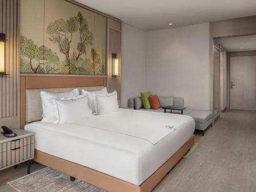 Una cama o camas en una habitación de NG Phaselis Bay