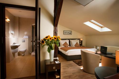 เตียงในห้องที่ Spatz Aparthotel