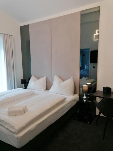 Кровать или кровати в номере The Place Boutique & Design Hotel Flachau