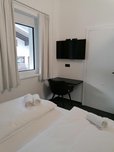 Кровать или кровати в номере The Place Boutique & Design Hotel Flachau