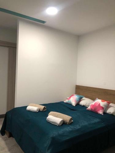 a bedroom with two beds with towels on them at Hotel Story in Sarajevo