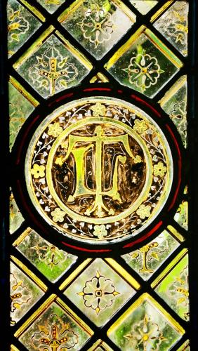 a stained glass window with a design on it at Nailcote Hall in Berkswell
