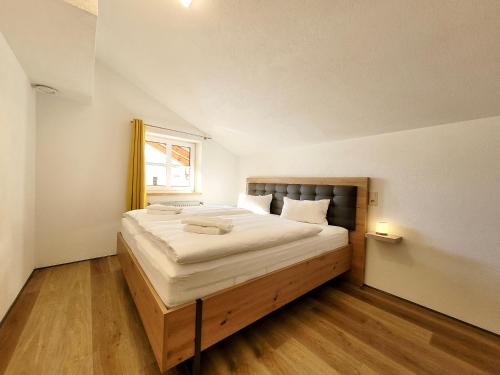 a bedroom with a large bed in a room at Ferienwohnung Flachau Oberlehengut in Flachau