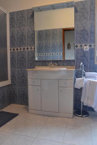 a bathroom with a sink and a mirror at Casal Alentejano in Sintra