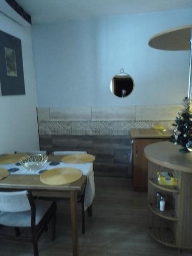 a room with tables and a christmas tree on the wall at Willa Gracja in Wisła