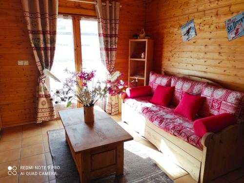 a living room with a couch and a table at Chalet Le Cambre d'Aze in Font-Romeu