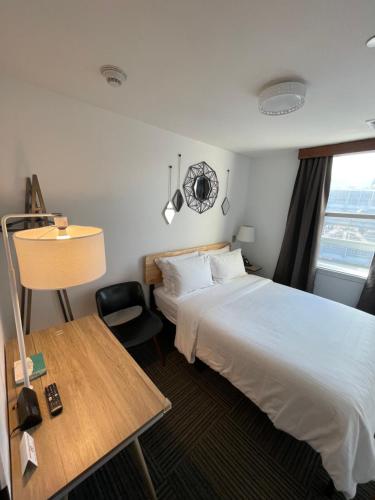Una cama o camas en una habitación de Hotel Mimosa