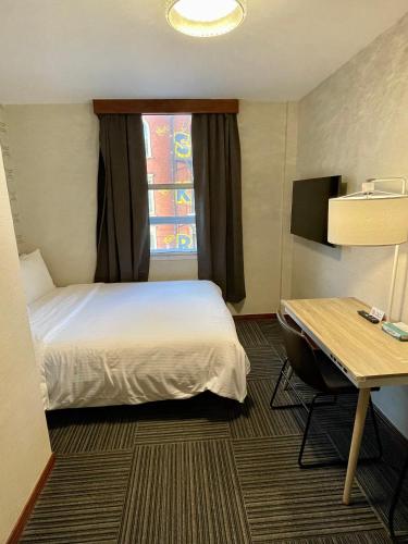 Una cama o camas en una habitación de Hotel Mimosa