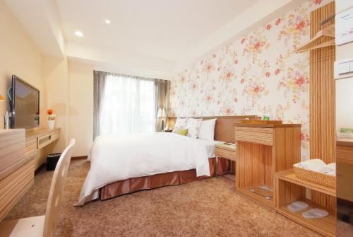 TV a/nebo společenská místnost v ubytování NAGAHIRO Hotel
