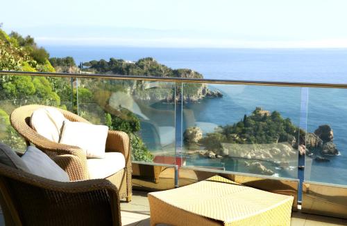 a balcony with a view of the ocean at Maison Blanche Taormina in Taormina