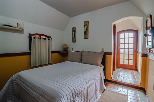 Ein Bett oder Betten in einem Zimmer der Unterkunft Mirágua Refugios Pousada