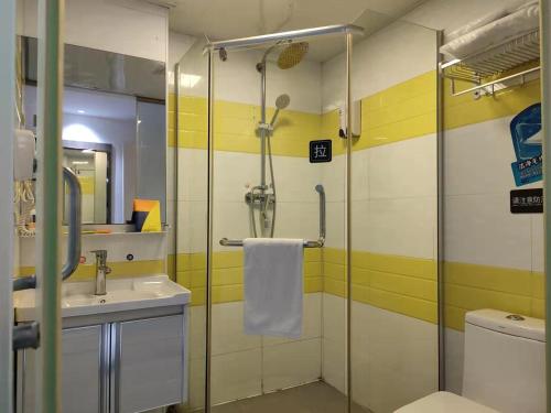 a bathroom with a shower and a sink and a toilet at 7Days Inn Chenzhou West High Speed Railway Station in Chenzhou