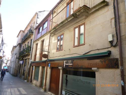 a building on the side of a street at Hotel Boa Vila in Pontevedra