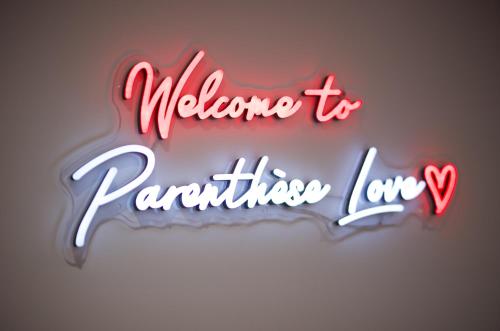 a neon sign that says welcome to parathesis lane at PARENTHESE LOVE - Amour & Tentation Suite Balnéo SPA Proche Orly-Paris in La Ville-du-Bois