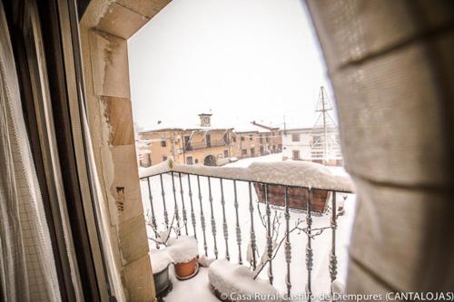 a view of a balcony with snow on the ground at Casa Rural Castillo Diempures in Cantalojas
